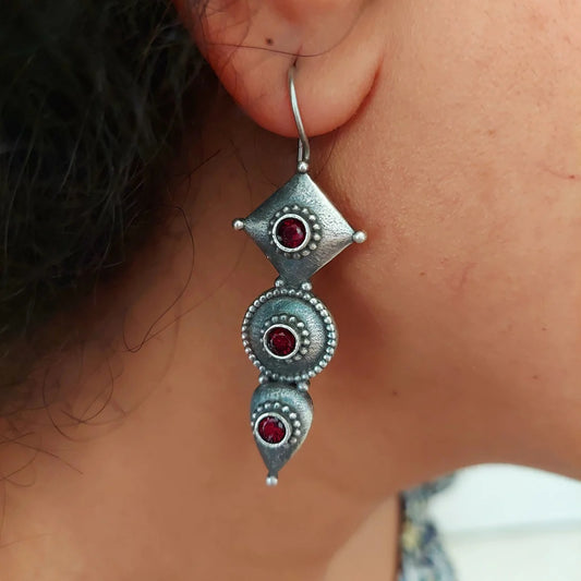 El Regalo's "Trikoni" Handcrafted Silver Lookalike Oxidized Brass Earrings in Antique Silver Finish with Red & Green Stones