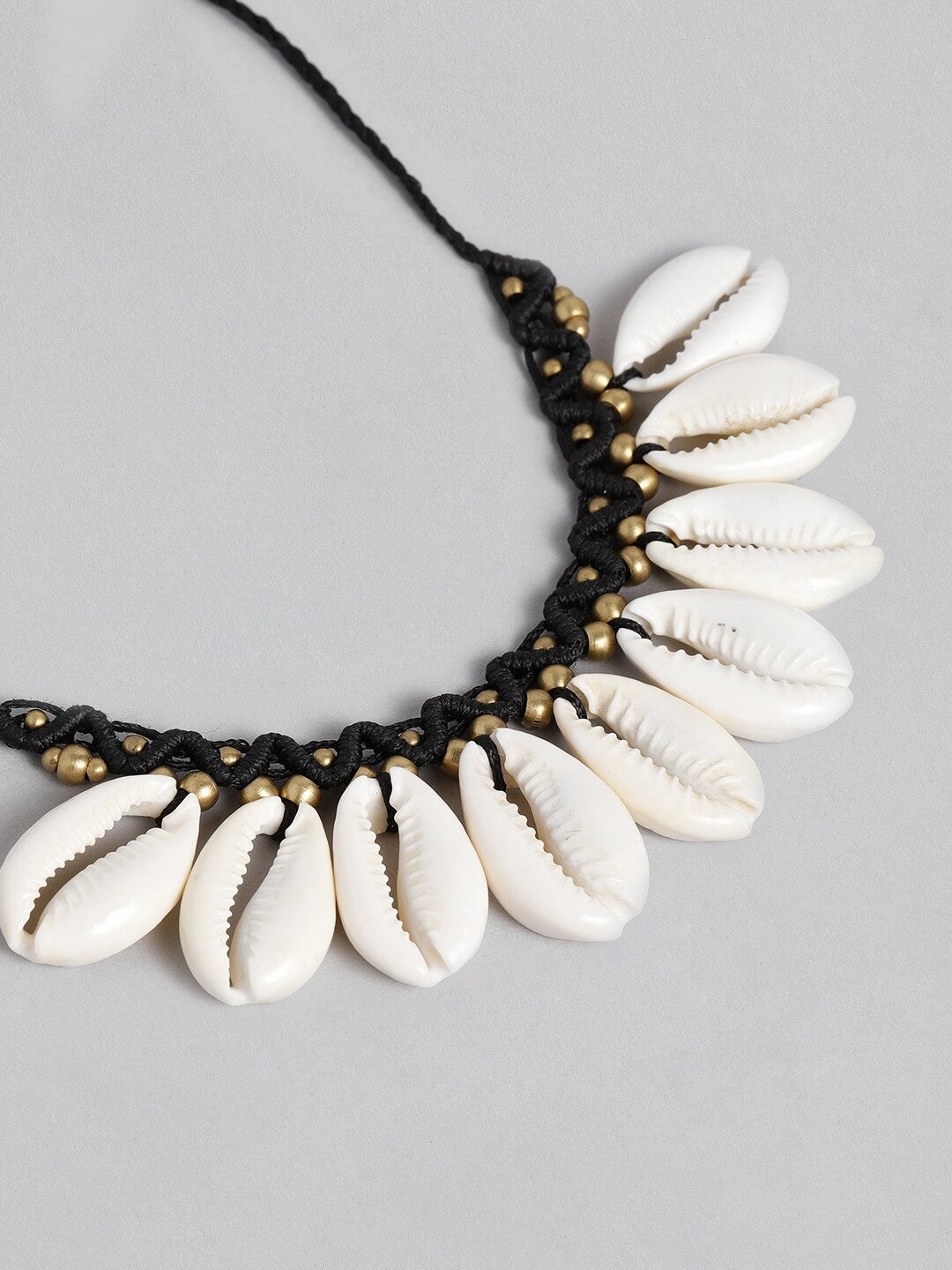 EL REGALO Black & Beige Big Cawrie Bohemian Necklace - for Women and Girls
Style ID: 16216034